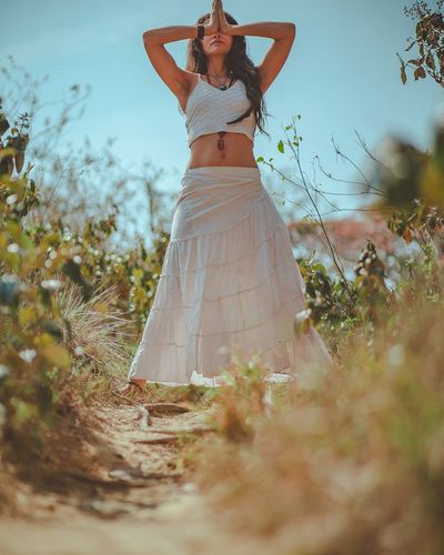 Detail of hands in a meditative mudra position.